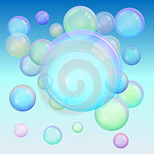 Colorful background of realistic transparent colorful soap bubbles with a rainbow reflection on a blue background