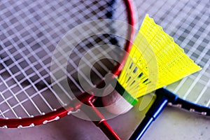 the colorful badminton rackets are laying on a tiled surface