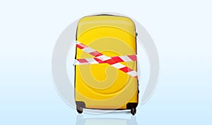 Colorful baggage wrapped in red and white barrier tape