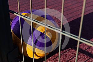 Colorful ball laying on the red ground at the sunset.