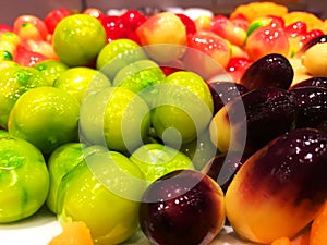 Colorful ball plated dessert in shape of fruits for sale at street food in Bangkok,Thailand. A popular