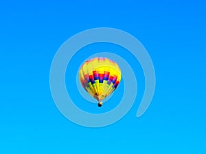 Colorful Balloon flyng in the blue sky photo