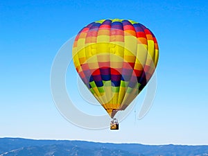 Colorful Balloon flyng in the blue sky photo