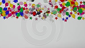 A colorful balloon and stars border with copy space