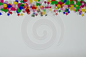 A colorful balloon and stars border with copy space