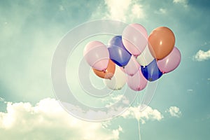 Colorful balloons on blue sky background