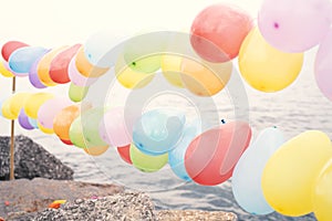 Colorful balloons on blue sky and sea background