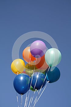 Colorful balloons in a clear blue sky