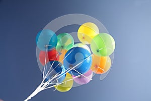Colorful balloons in a clear blue sky