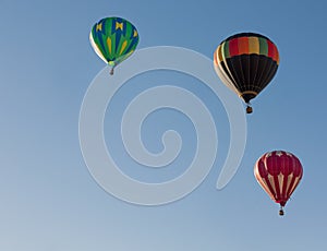 Colorful balloons flying through the blue sky. Utah, US