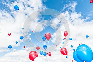 Colorful balloons over blue sky