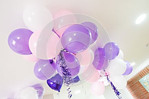 Colorful balloons in room prepared for birthday party