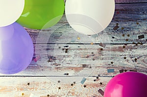 Colorful balloons on white vintage table. Copyspace