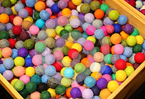 colorful balls made of boiled wool on sale in the hobby and pastime shop photo