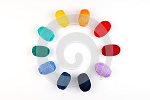 Colorful balls of wool in a circle.