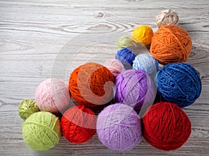 Colorful balls of yarn on a table