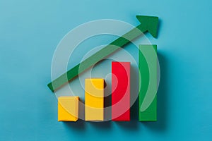Colorful bar chart with green arrow pointing upward, representing growth in values