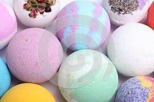 Colorful bath bombs on white background, above view