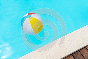 Colorful Beach Ball Floating on a swimming pool