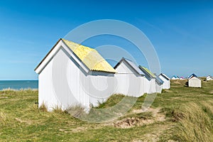 Colorful beach cabins, Normandy, France