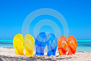 Colorful beach flip flops sandals on the beach