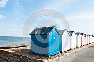 Colorful beach huts on a Suffolk beach