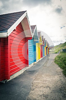 Colorful beach huts in Whitby, England