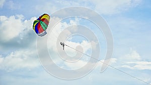 Colorful beach parachute in the sky