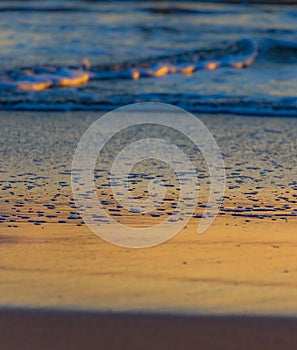 Colorful beach reflection at dawn