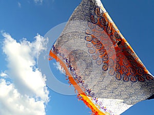 Colorful beach sarongs and a blue summer sky