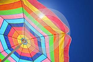 Colorful beach umbrella on a sunny day