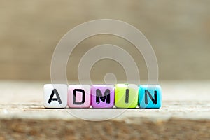 Colorful bead with letter in word admin Abbreviation of administration on wood background