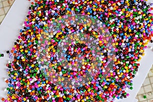 Colorful beads for crafts. Black and white.