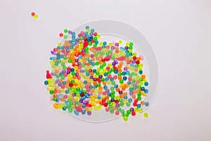 Colorful beads on white background close up