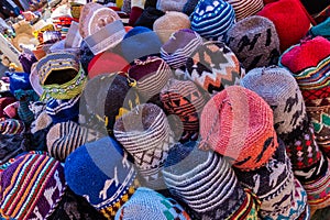colorful beanies in a shop in a souk in marrakech.