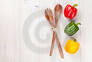 Colorful bell peppers and kitchen utensil