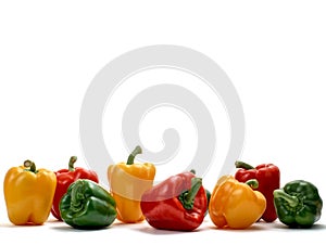 Colorful bell peppers on white studio background