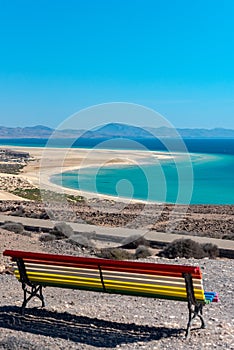 Colorful bench to contemplate View in Playa de Sotavento, Fuerteventura in Spain in summer