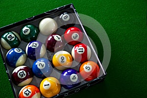 Colorful billiard balls in box