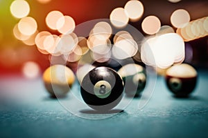 Colorful billiard balls on table close up