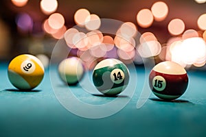 Colorful billiard balls on table close up