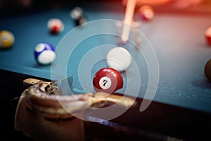 Colorful billiard balls on table in pub macro photo. Gambling concept