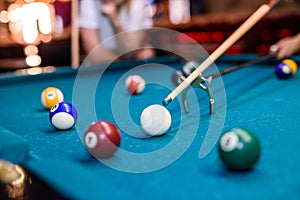 Colorful billiard balls on table in pub macro photo. Gambling concept