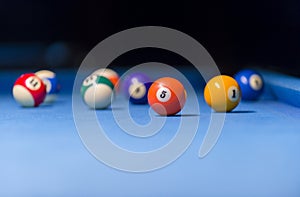 Colorful billiards balls. Billiard ball at blue table. Colorful