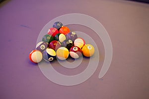 Colorful billiards balls. Billiard ball at blue table. Colorful American pool snooker balls background. American Billiard in bar.