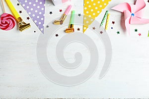 Colorful birthday accessories on white wooden background, flat lay. Space for