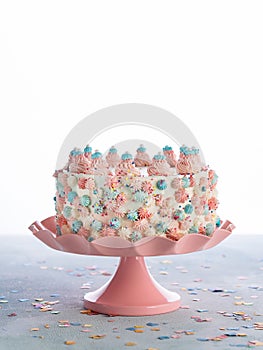Colorful Birthday cake with sprinkles over White Background. Celebration Childs birthday party concept.