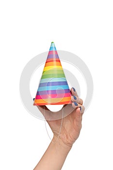 Colorful birthday cap in woman hands isolated on white background