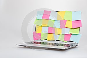 Colorful blank paper memos stuck to a laptop