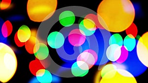 Colorful blinking bokeh festive light particles